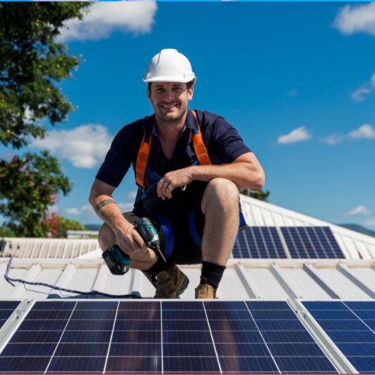 Man on roof fixing solar panels 2
